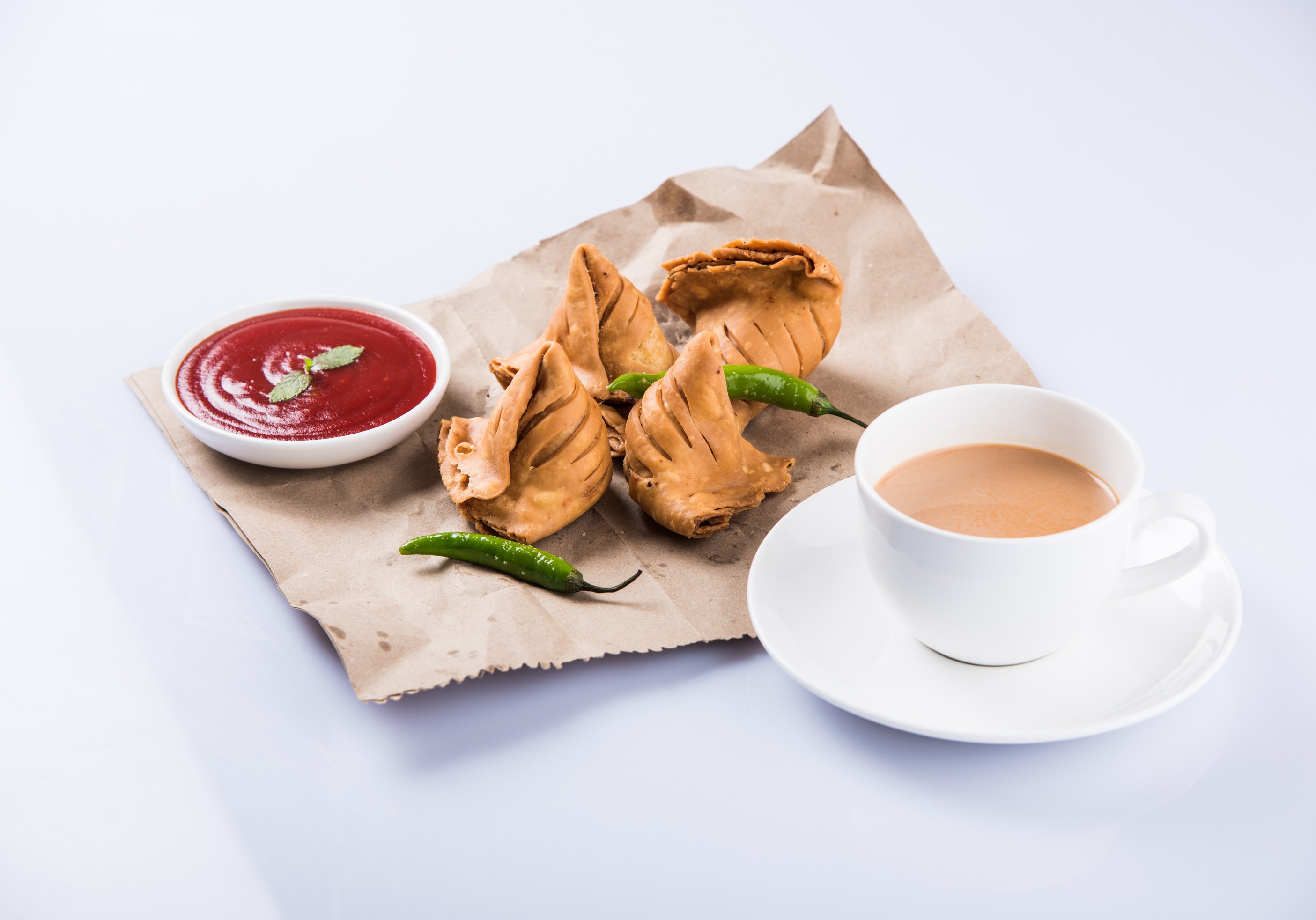 Samosa snack with tomato ketchup and hot tea